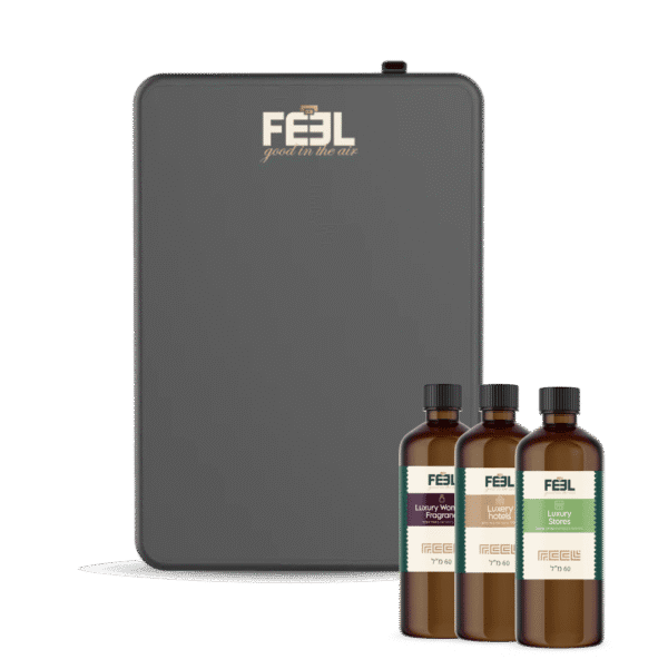 מכשיר אפור עם לוגו "FEEL" ושלושה בקבוקי תמצית ריח חומים עם תוויות שונות.