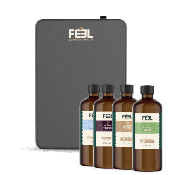 מכשיר אפור של חברת "FEEL" וארבעה בקבוקי תמציות ריח חומות עם תוויות שונות.